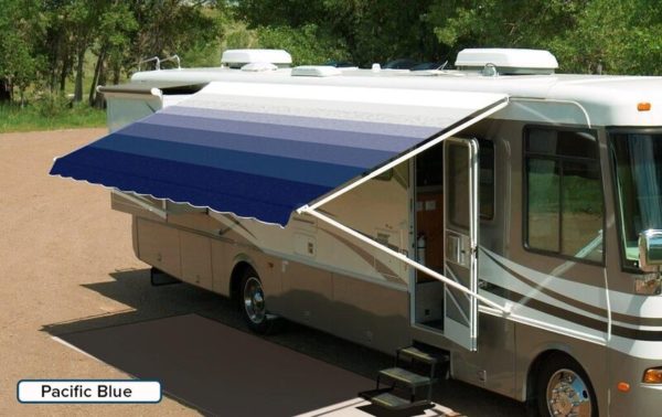 A RV with an extended awning labeled "Pacific Blue"