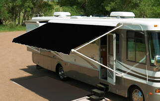 RV with a black dometic awning with metal wrap