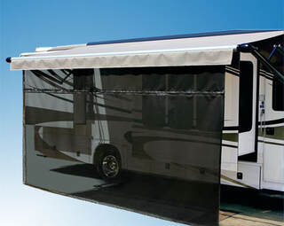 An RV with extended awning and attached black zip blocker