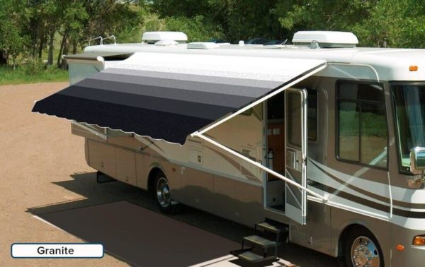 A RV with an extended awning labeled "Granite"