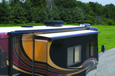 A RV with a SOK III with deflector and cover